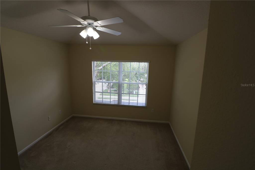 4866 Pond Ridge Drive Riverview, FL 33578 - Photo 36 of 38 an empty room with a window and a fan