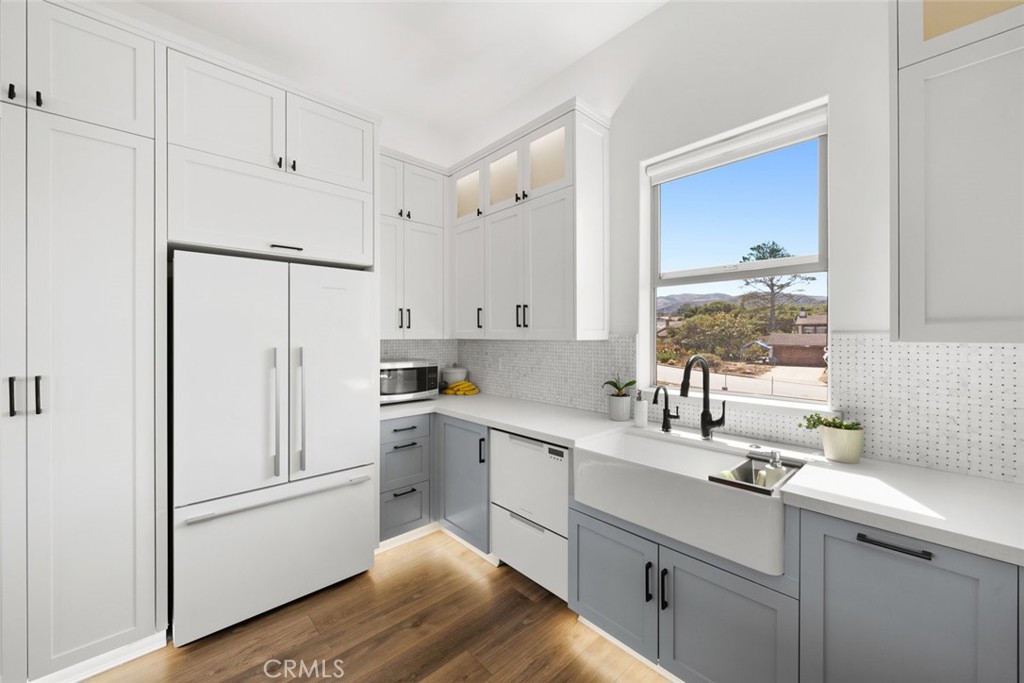 1301 Los Osos Valley Road Los Osos, CA 93402 - Photo 13 of 75 a kitchen with a sink a window and stainless steel appliances