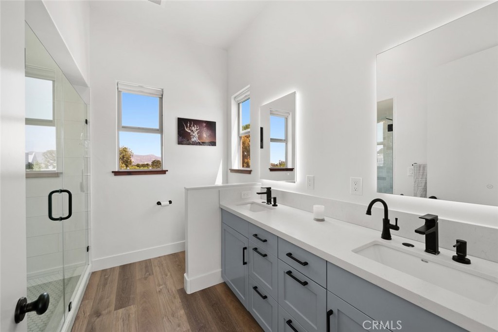 1301 Los Osos Valley Road Los Osos, CA 93402 - Photo 25 of 75 a bathroom with double vanity sinks double vanity tub and next to a window