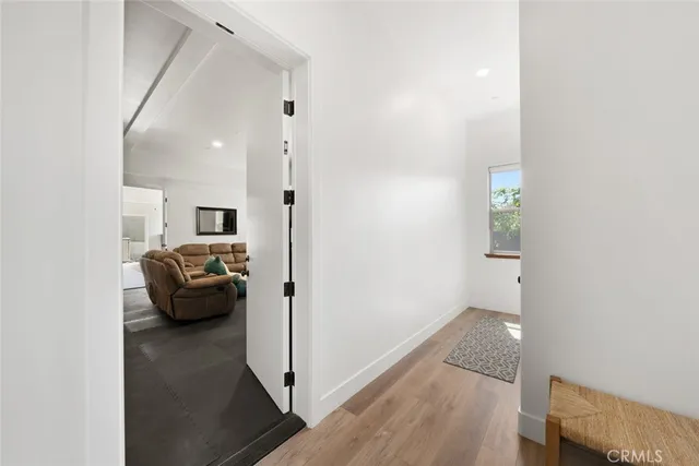 a spacious bathroom with double sink a large mirror and a shower