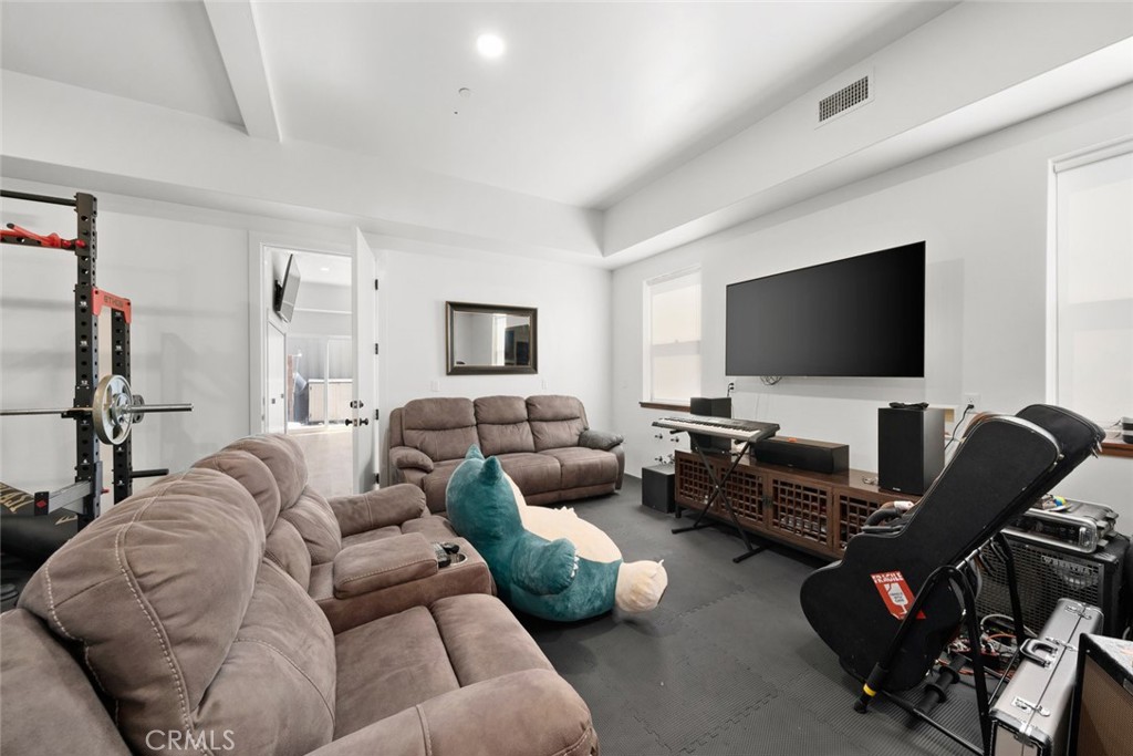 1301 Los Osos Valley Road Los Osos, CA 93402 - Photo 38 of 75 a living room with furniture and a flat screen tv