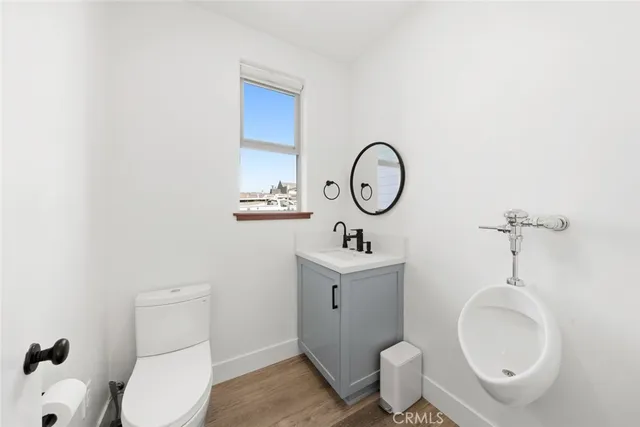 a view of a room with table and chairs