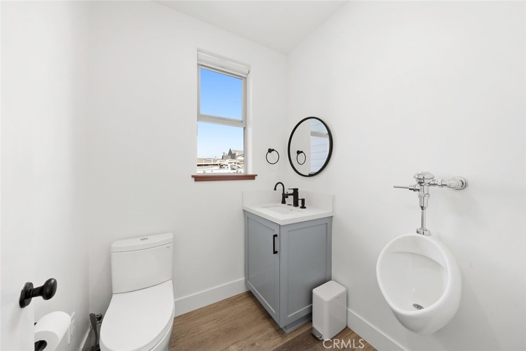 1301 Los Osos Valley Road Los Osos, CA 93402 - Photo 40 of 75 a bathroom with a toilet a sink and mirror