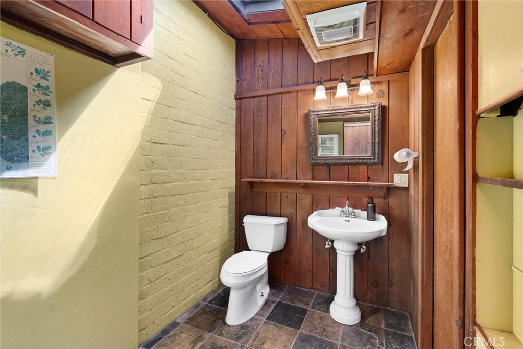 1301 Los Osos Valley Road Los Osos, CA 93402 - Photo 59 of 75 a bathroom with a toilet sink and mirror