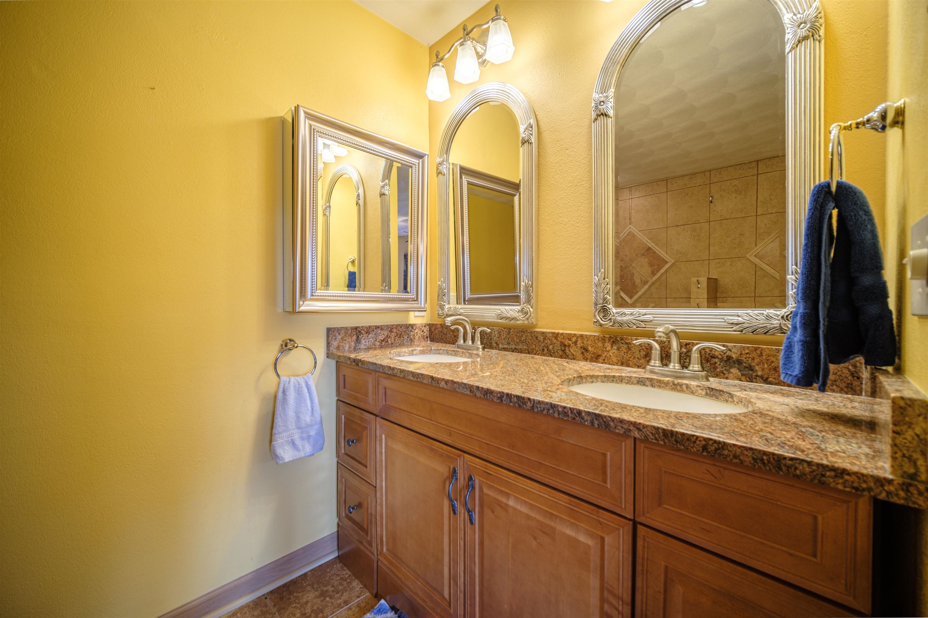 5592 Spring Brook Road Rockford, IL 61114 - Photo 11 of 53 a bathroom with a granite countertop sink and a mirror