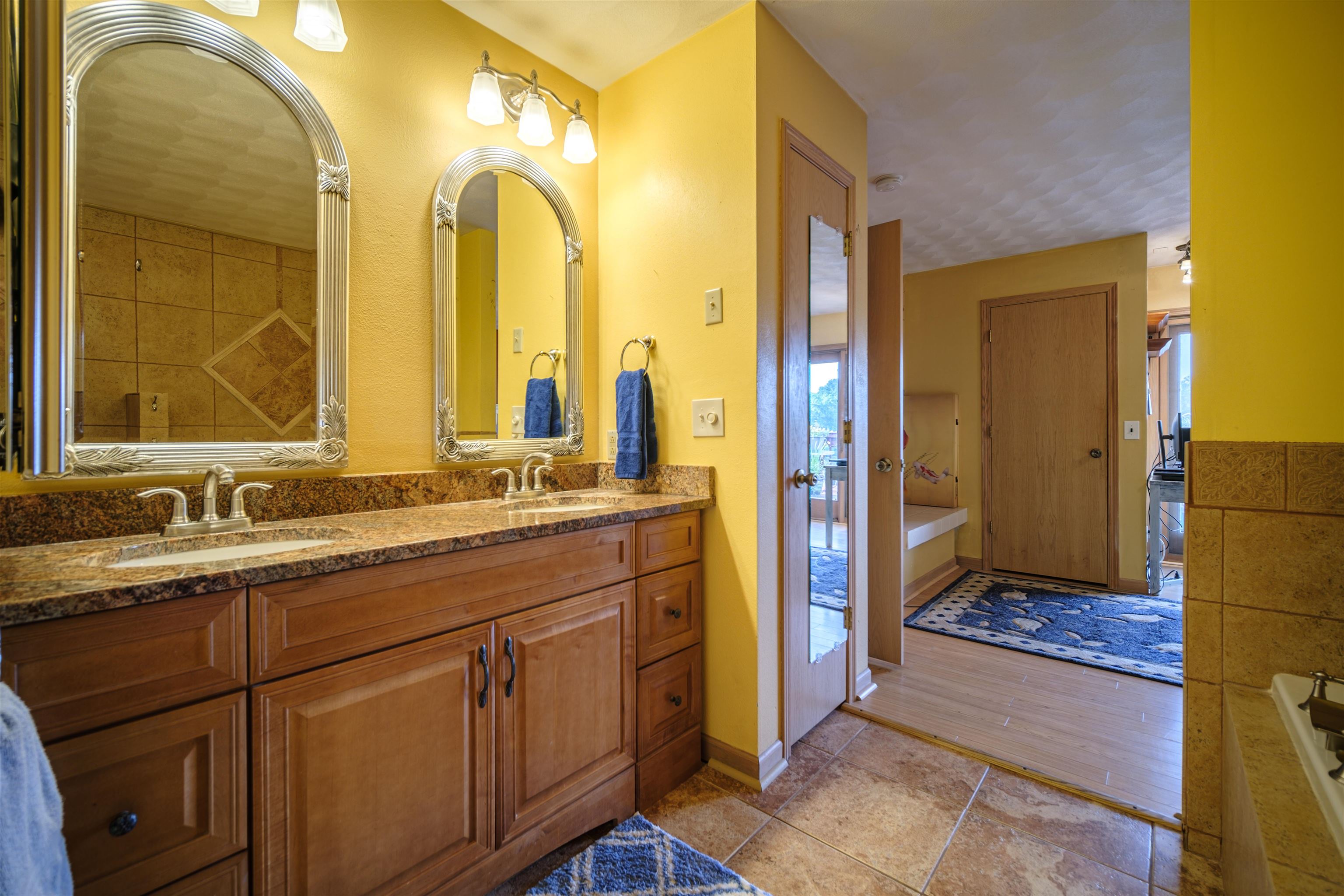 5592 Spring Brook Road Rockford, IL 61114 - Photo 13 of 53 a bathroom with a double vanity sink and a mirror