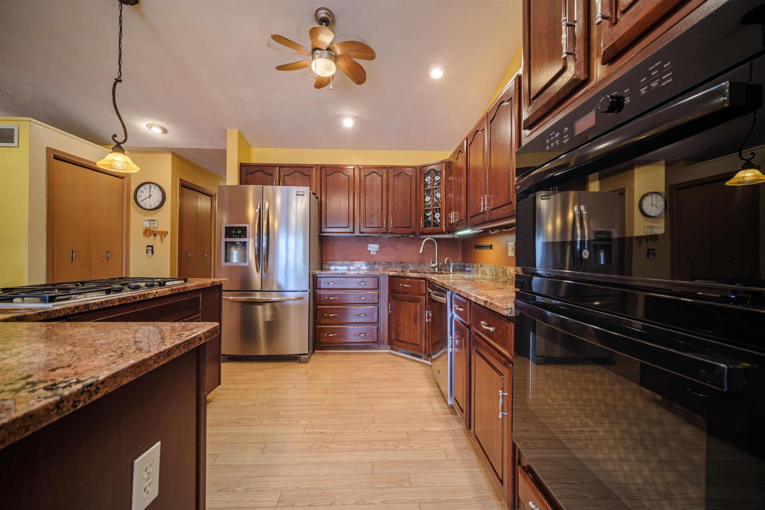 5592 Spring Brook Road Rockford, IL 61114 - Photo 16 of 53 a kitchen with stainless steel appliances granite countertop a stove a refrigerator and a sink