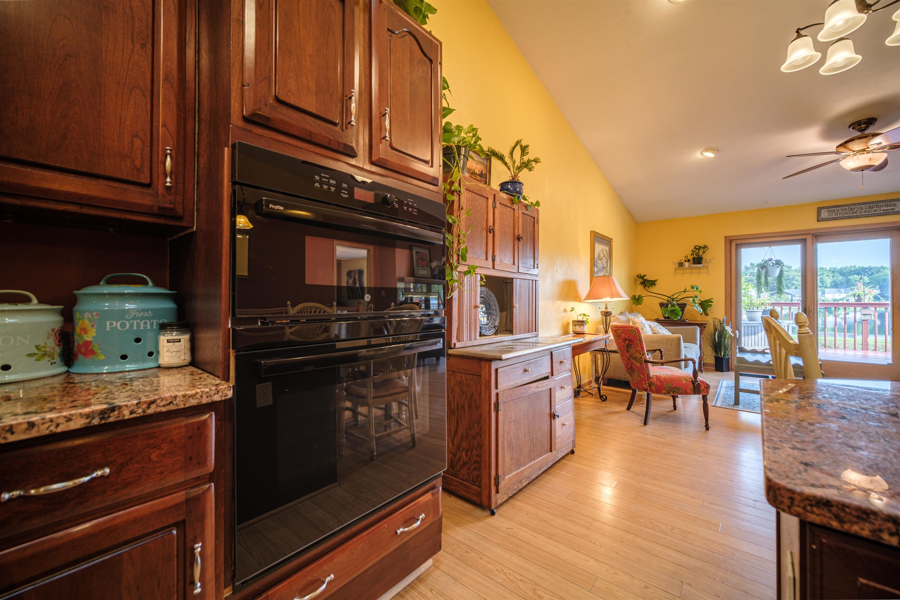 5592 Spring Brook Road Rockford, IL 61114 - Photo 17 of 53 a kitchen with stainless steel appliances granite countertop a stove and cabinets