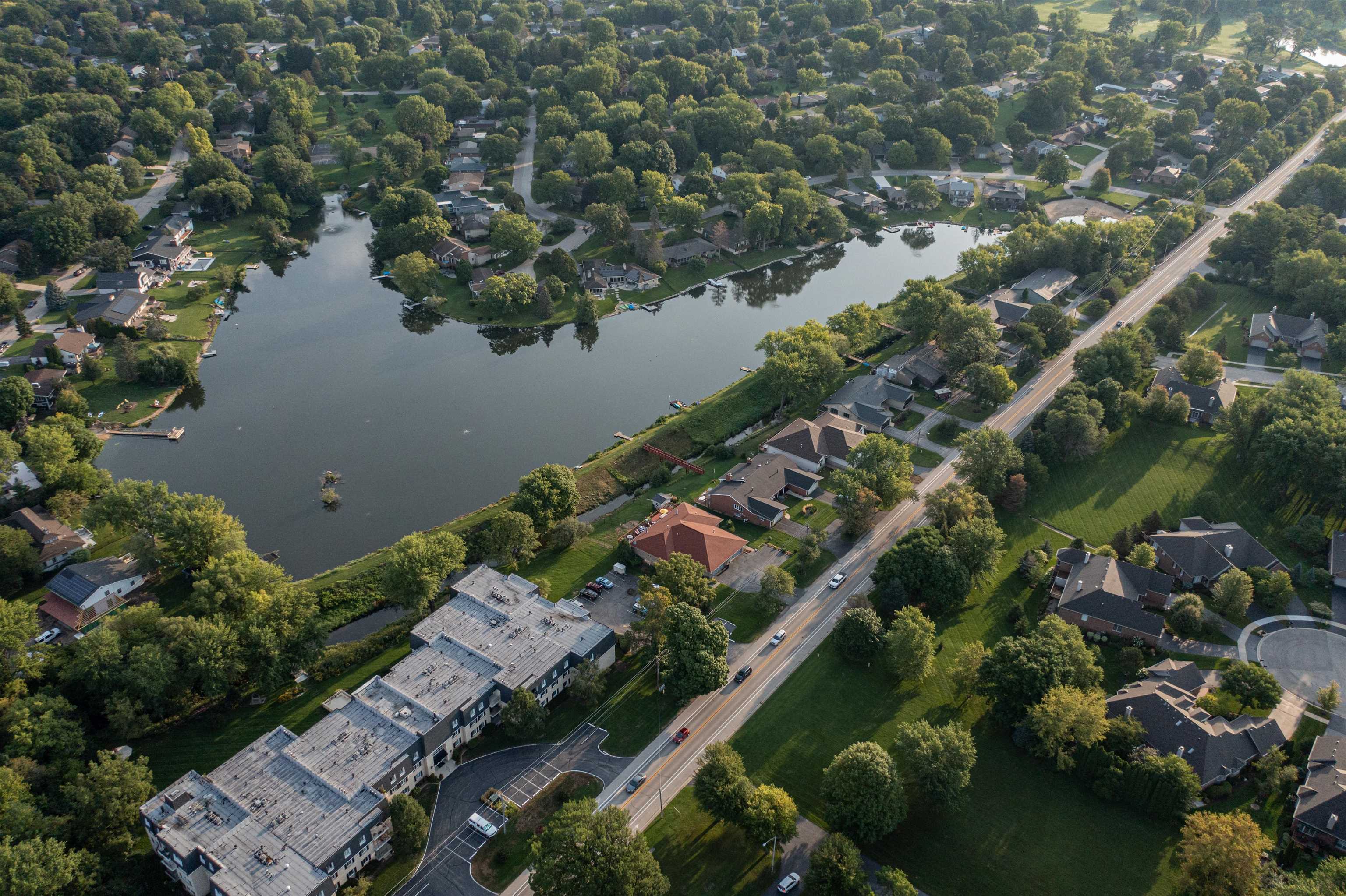 5592 Spring Brook Road Rockford, IL 61114 - Photo 2 of 53 an aerial view of a house with a lake view