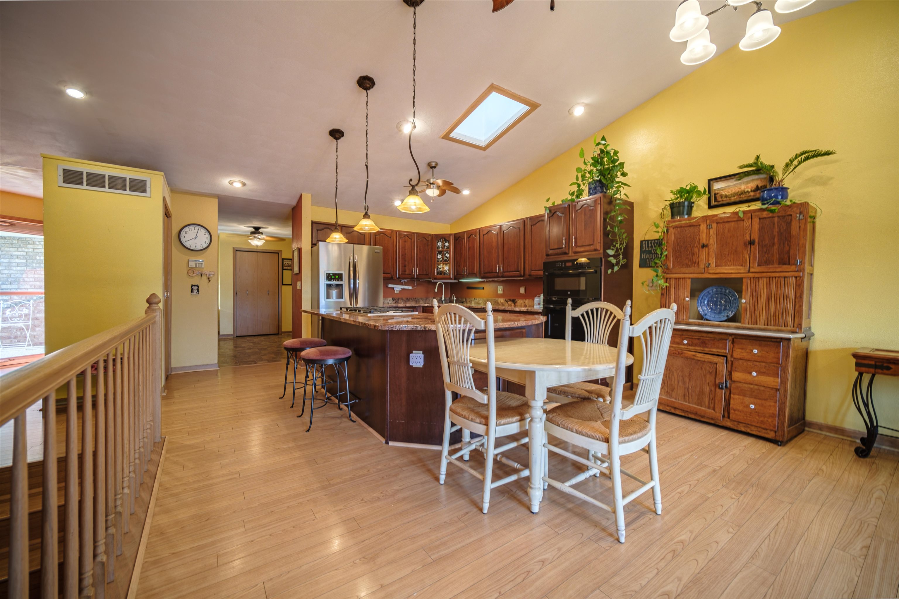 5592 Spring Brook Road Rockford, IL 61114 - Photo 23 of 53 a dining room with furniture and wooden floor