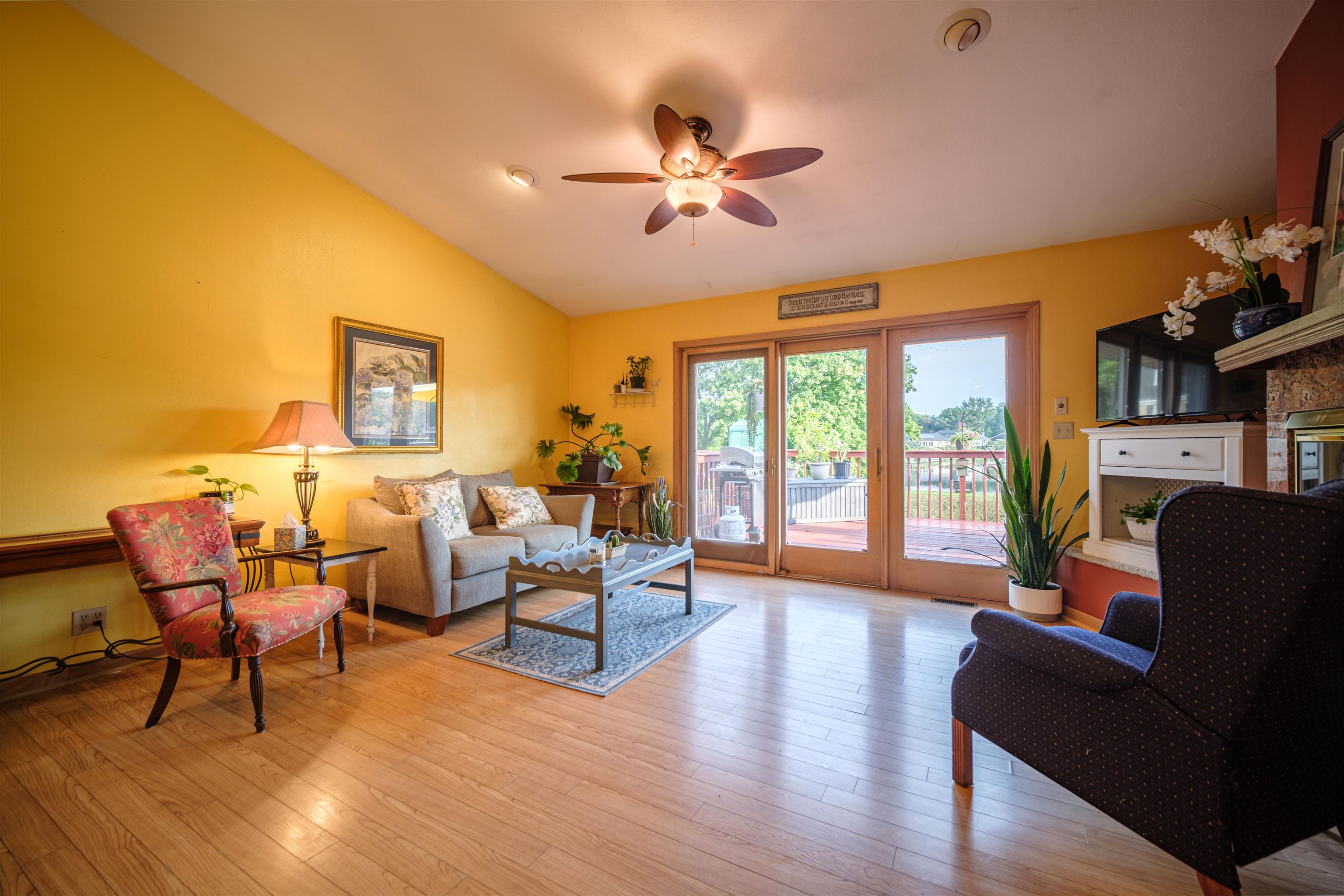 5592 Spring Brook Road Rockford, IL 61114 - Photo 24 of 53 a living room with furniture and a floor to ceiling window