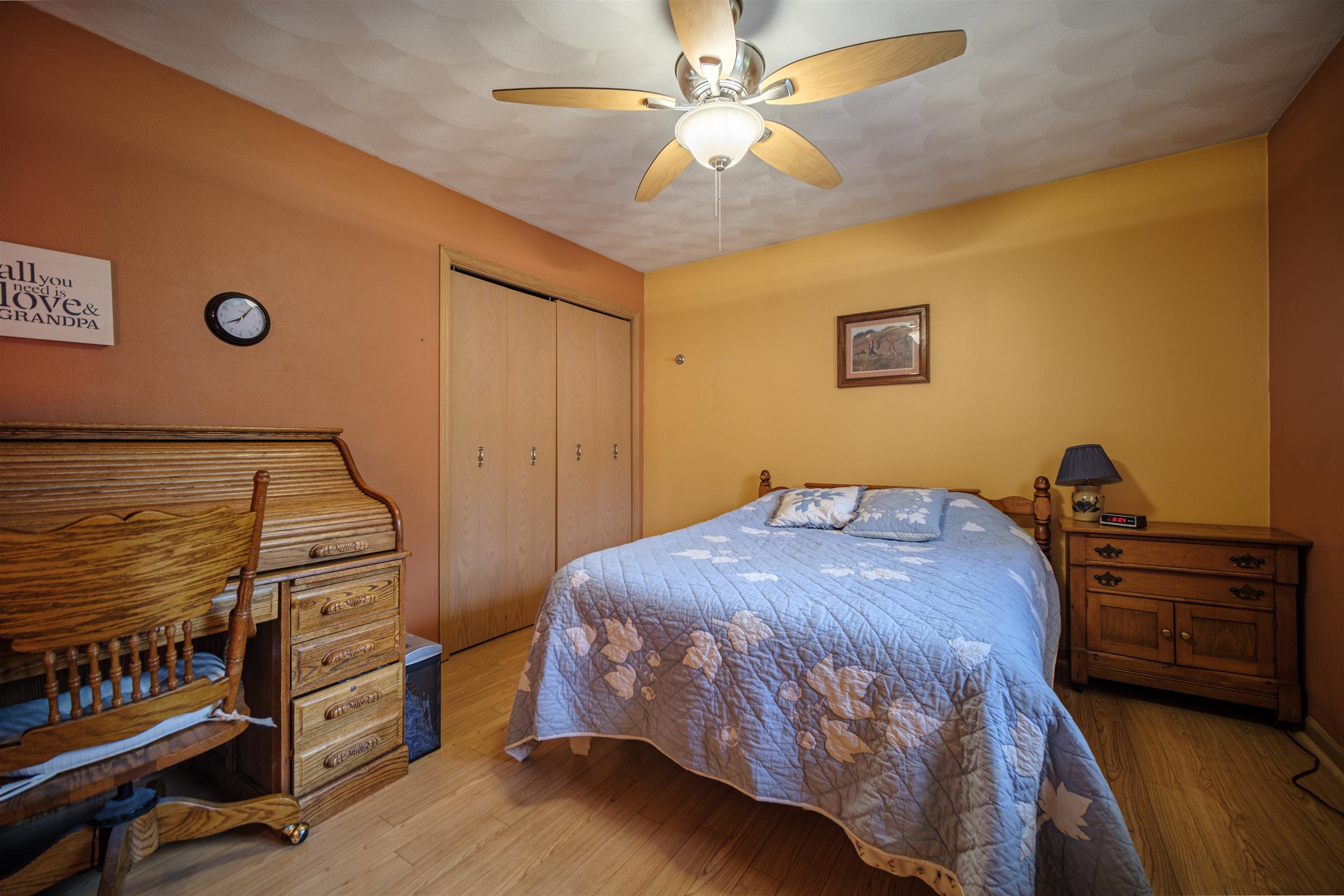 5592 Spring Brook Road Rockford, IL 61114 - Photo 27 of 53 a bedroom with a bed and a chandelier