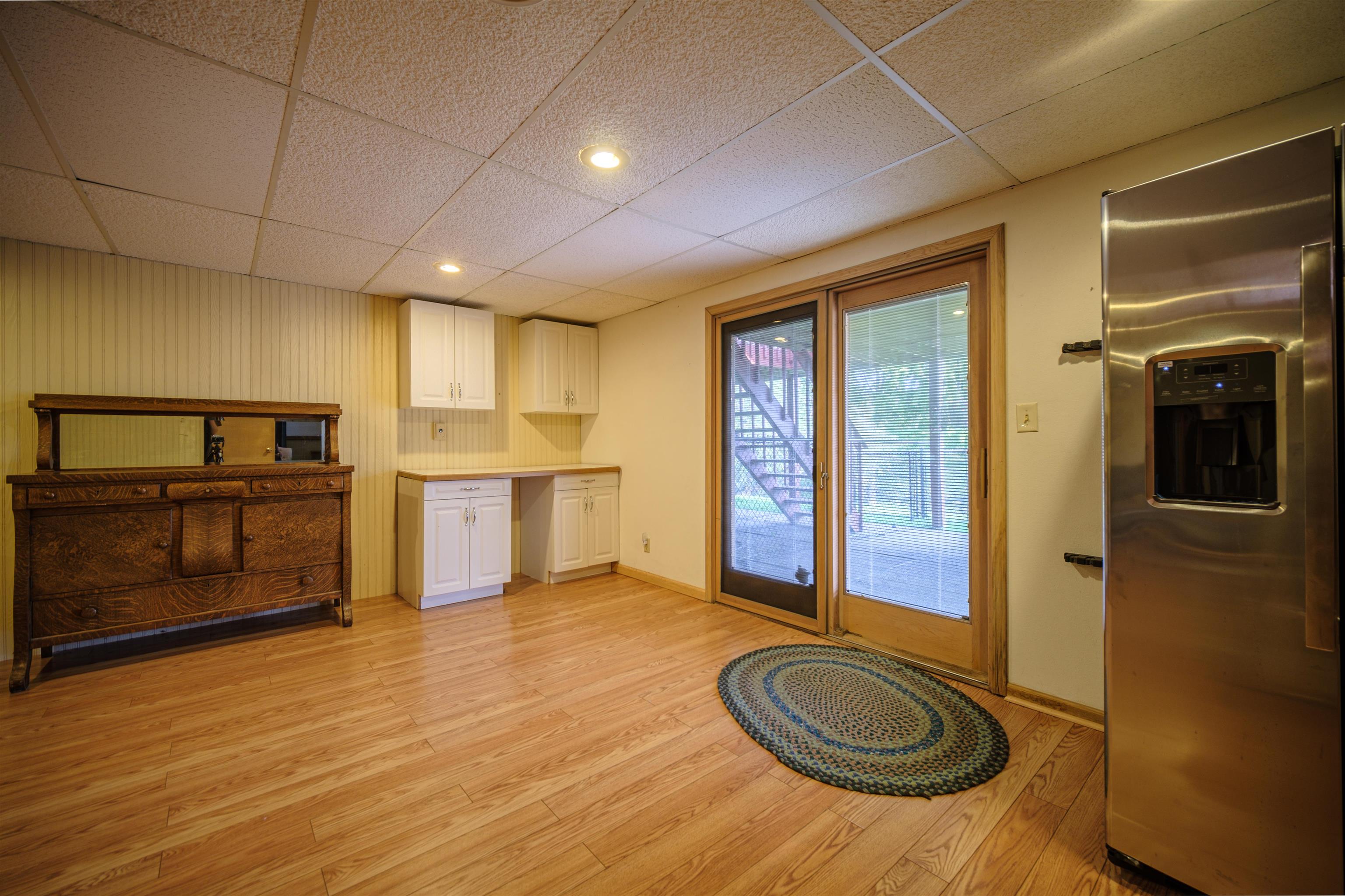 5592 Spring Brook Road Rockford, IL 61114 - Photo 30 of 53 a view of a livingroom with furniture and a kitchen