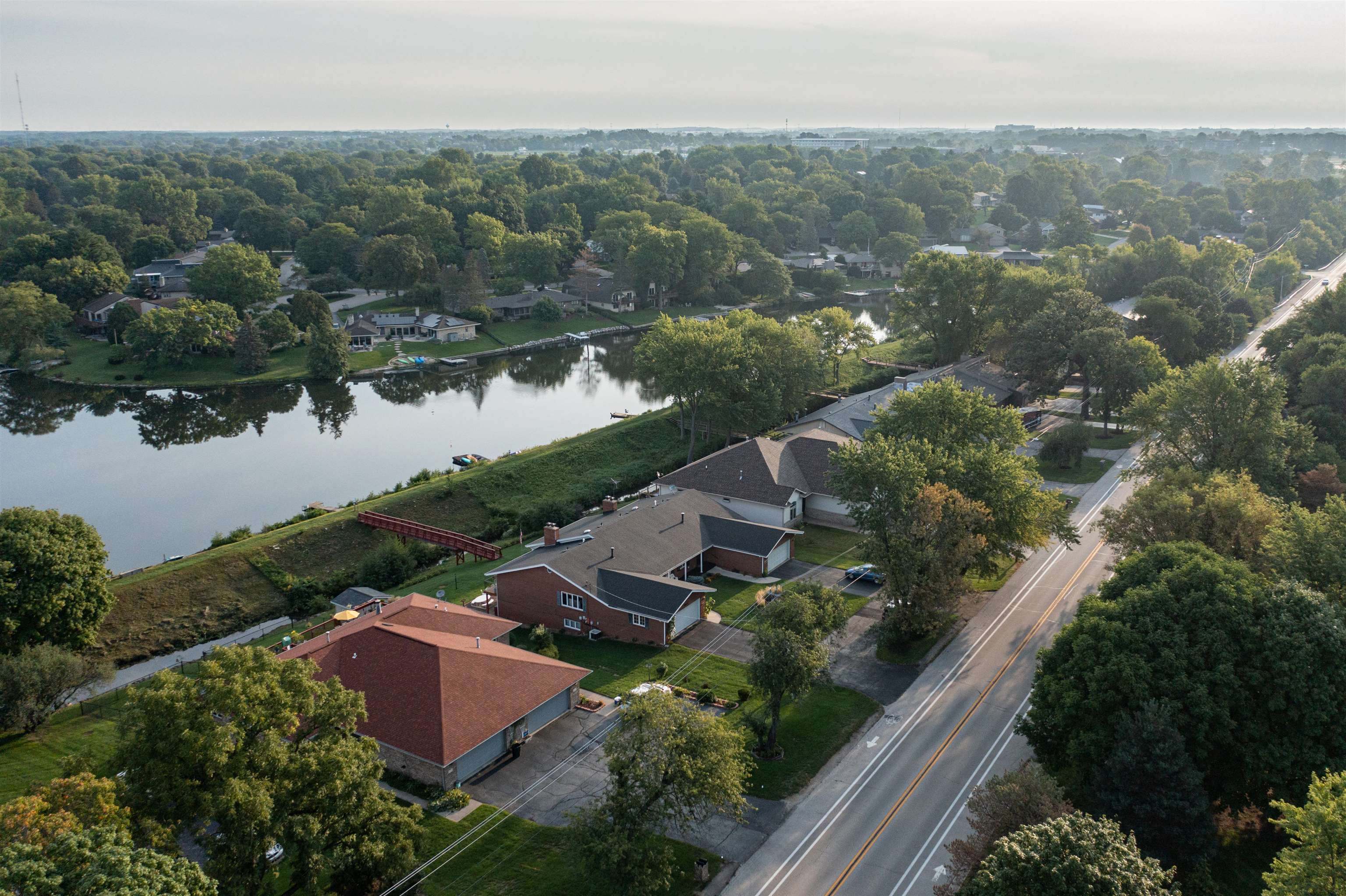 5592 Spring Brook Road Rockford, IL 61114 - Photo 3 of 53 an aerial view of residential houses with outdoor space and river