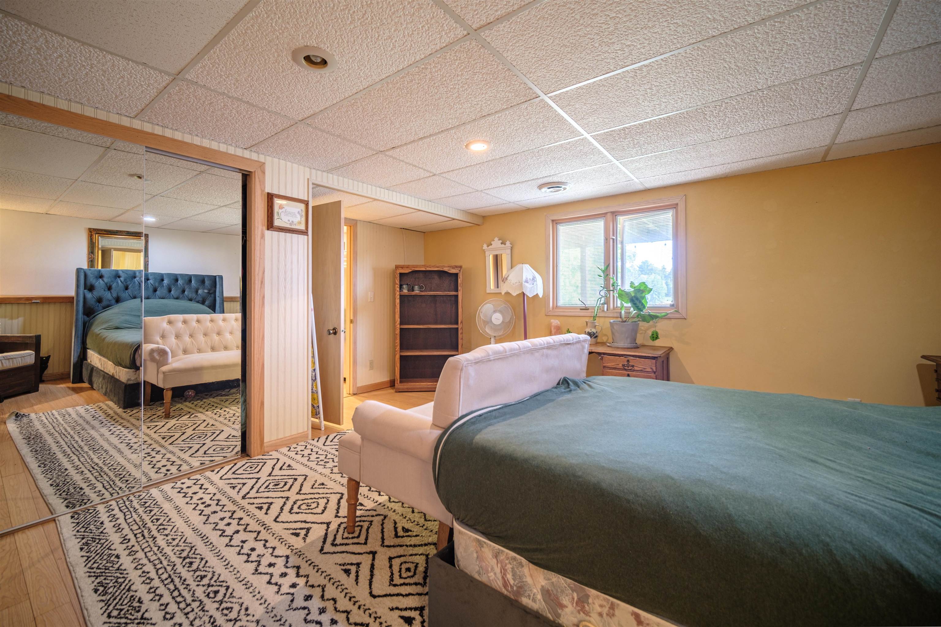 5592 Spring Brook Road Rockford, IL 61114 - Photo 33 of 53 a spacious bedroom with two beds and a couch