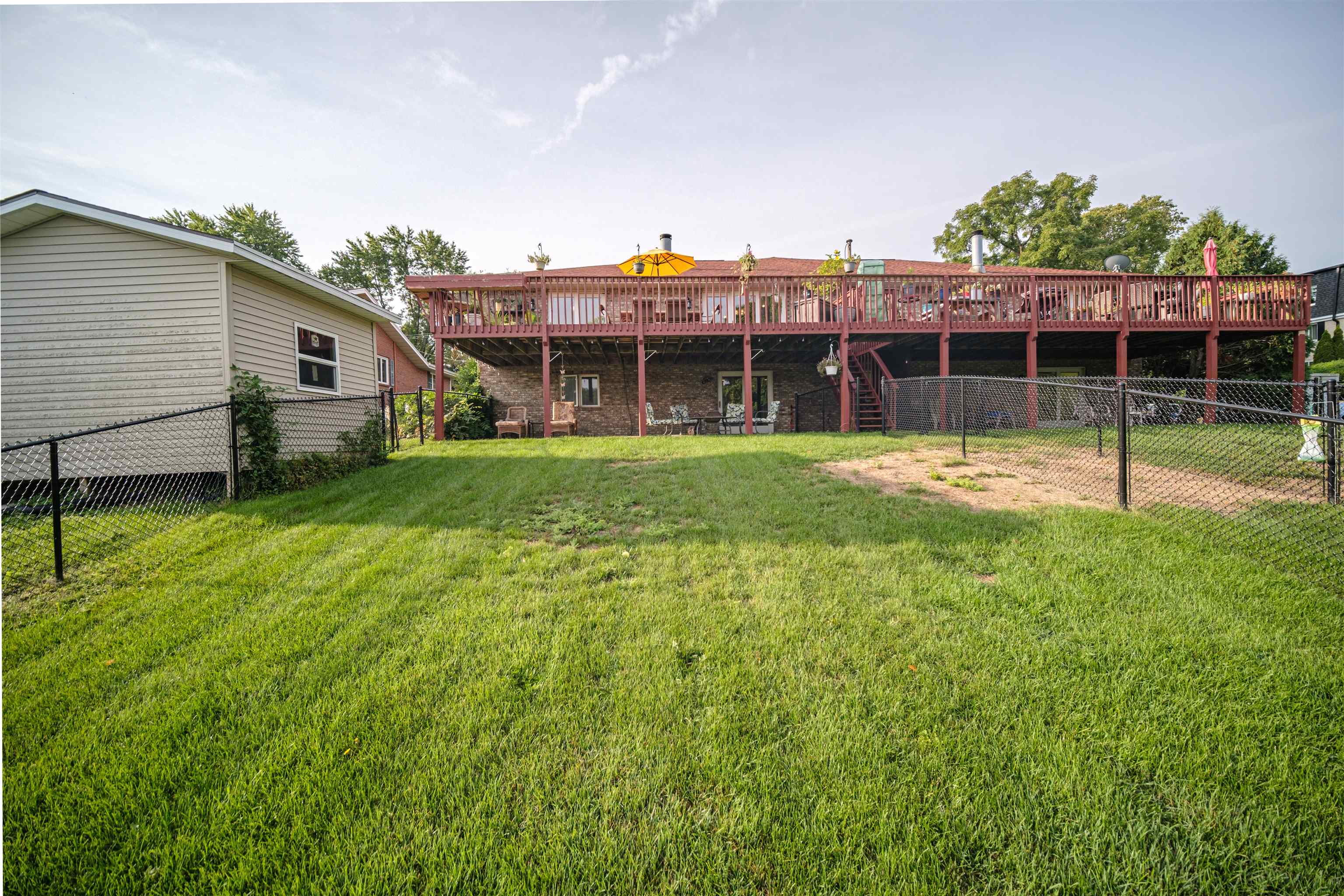 5592 Spring Brook Road Rockford, IL 61114 - Photo 44 of 53 a view of a house with backyard and garden