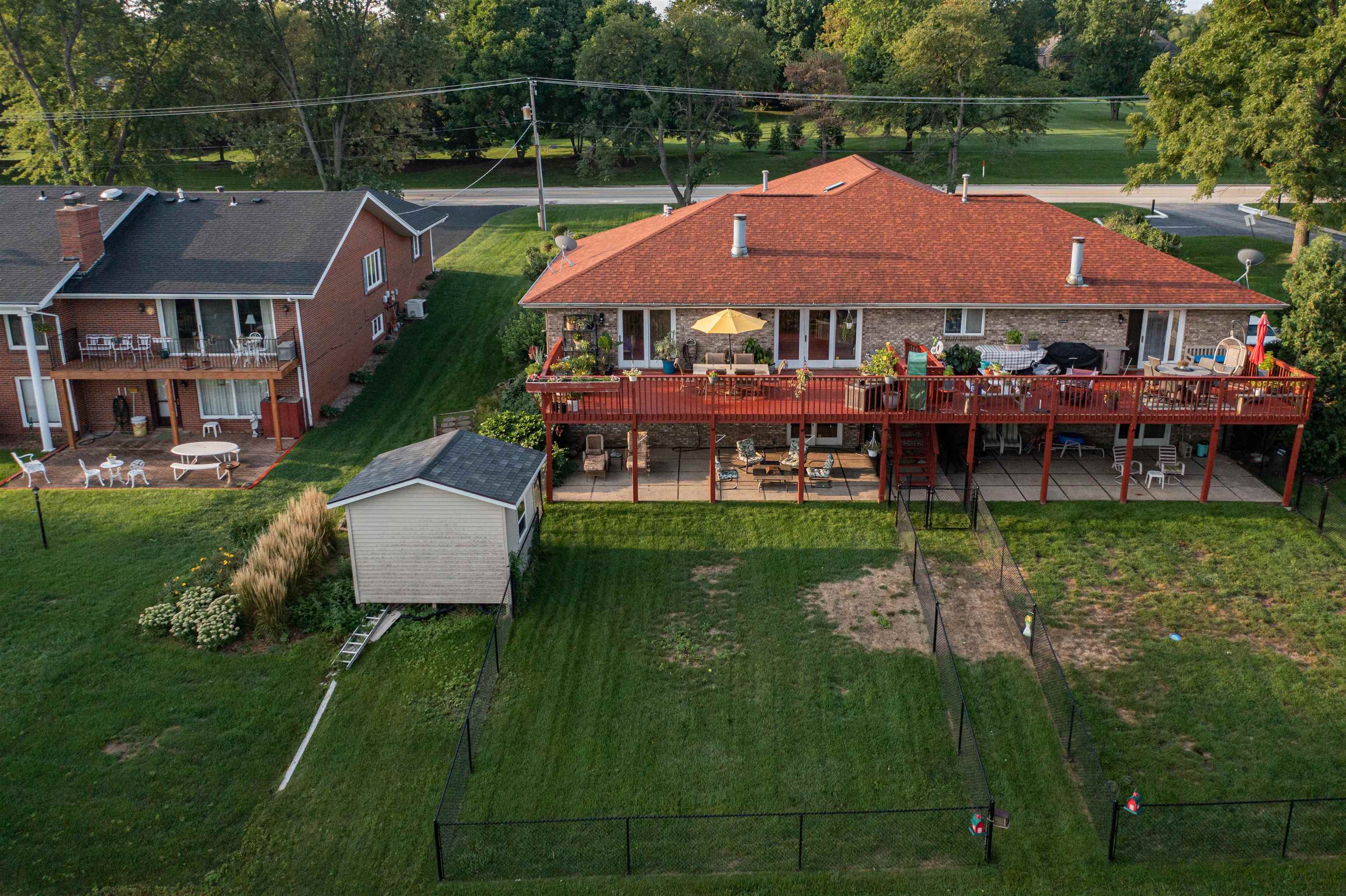 5592 Spring Brook Road Rockford, IL 61114 - Photo 47 of 53 a aerial view of a house with garden space and a patio