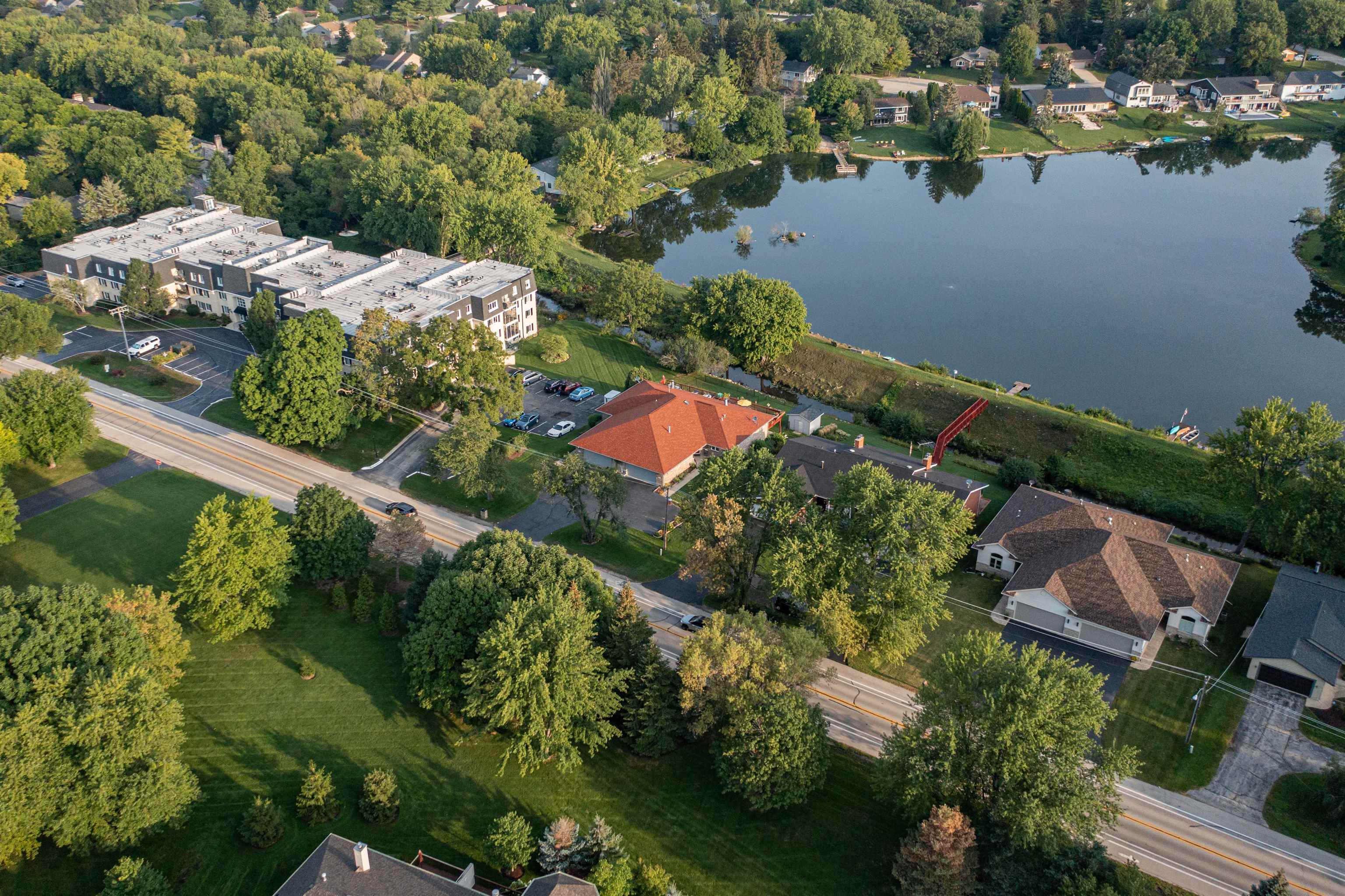 5592 Spring Brook Road Rockford, IL 61114 - Photo 51 of 53 an aerial view of residential houses with outdoor space and lake view