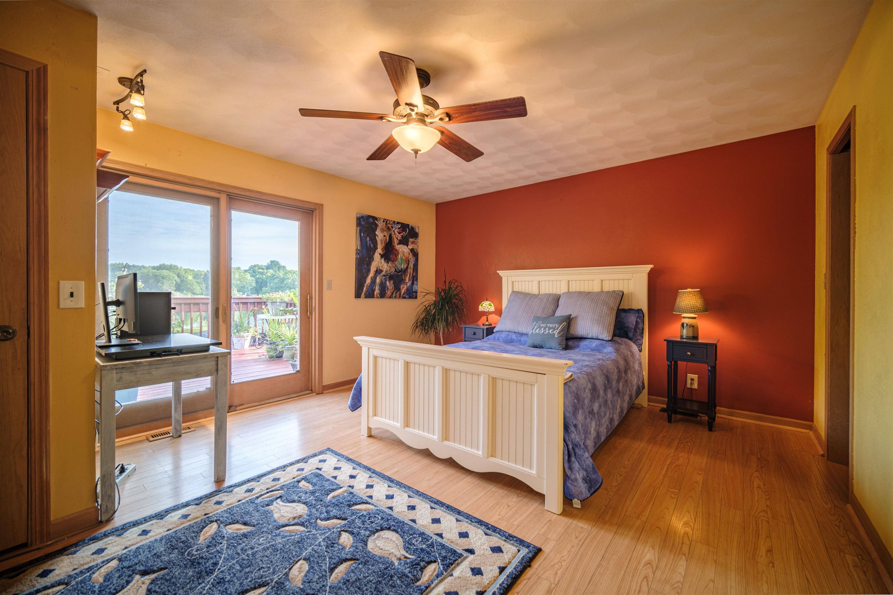 5592 Spring Brook Road Rockford, IL 61114 - Photo 9 of 53 a bed room with a bed and a chandelier
