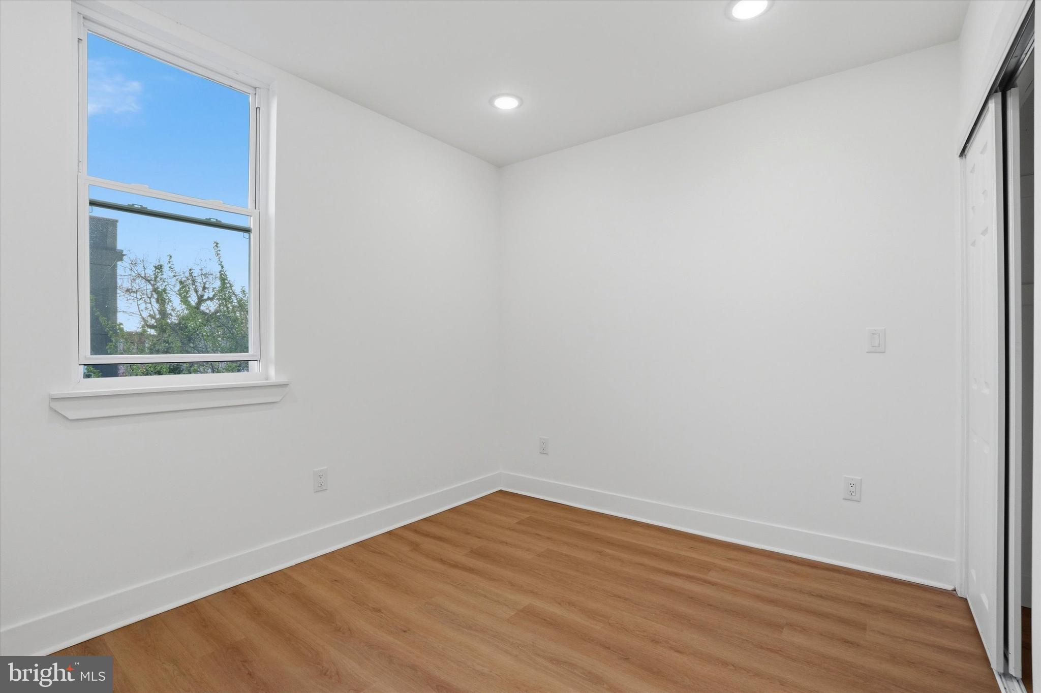 2104 North 8th Street, Unit 3 Philadelphia, PA 19122 - Photo 13 of 15 a view of empty room with wooden floor and fan