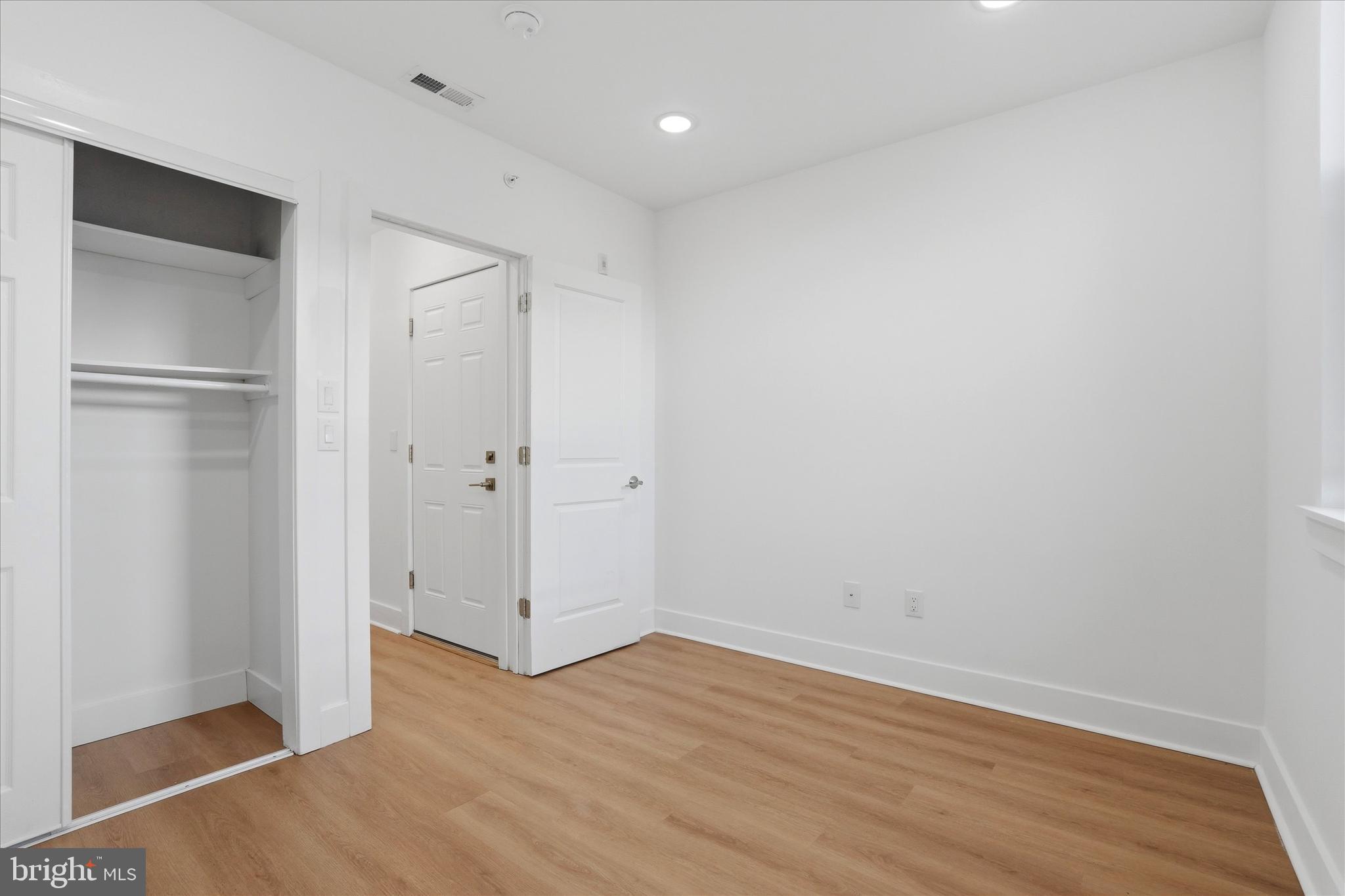 2104 North 8th Street, Unit 3 Philadelphia, PA 19122 - Photo 14 of 15 a view of an empty room with wooden floor