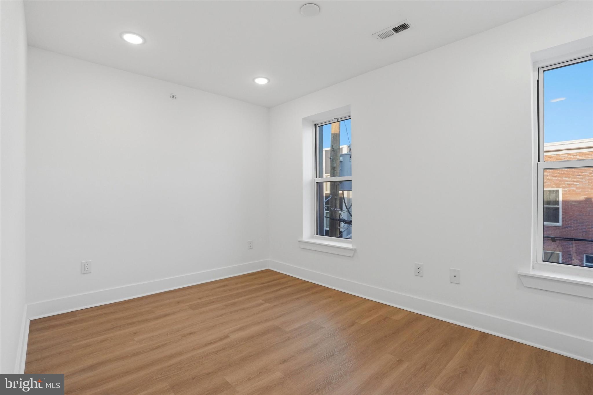 2104 North 8th Street, Unit 3 Philadelphia, PA 19122 - Photo 8 of 15 an empty room with windows