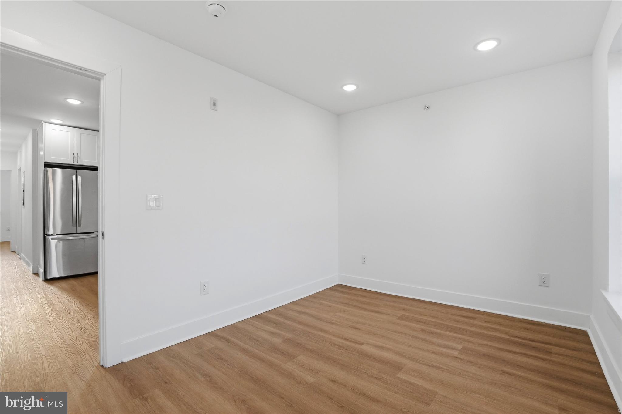 2104 North 8th Street, Unit 3 Philadelphia, PA 19122 - Photo 10 of 15 a view of a room with wooden floor and a sink