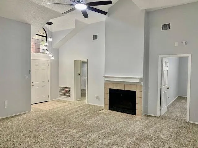 a view of empty room with fireplace