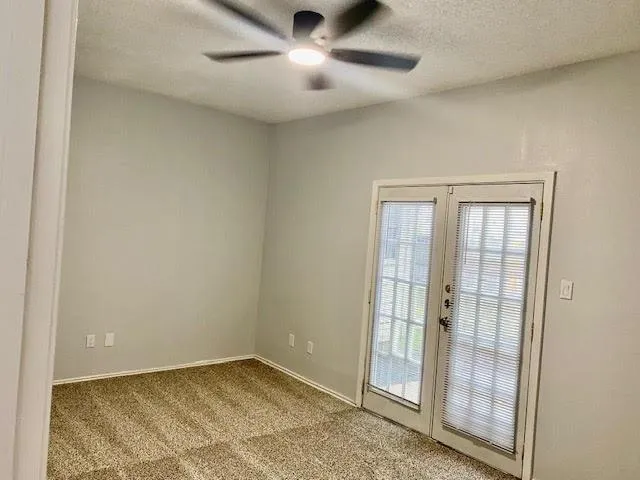 an empty room with closet area
