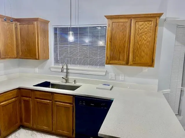 a kitchen with a sink and cabinets