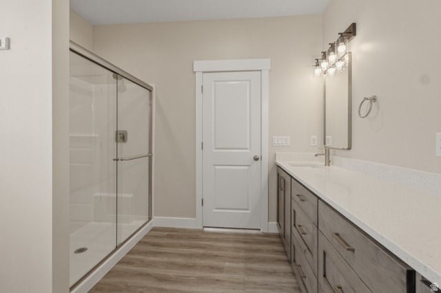 169 West 100 South Joseph, UT 84739 - Photo 18 of 35 Bathroom with a shower stall, vanity, and light wood finished floors
