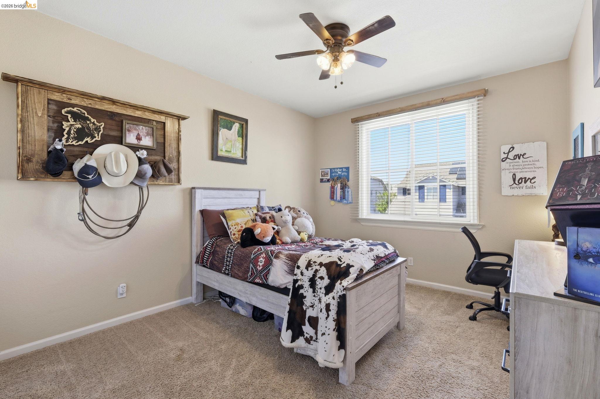 3438 Keystone Loop Discovery Bay, CA 94505 - Photo 33 of 57 a bedroom with a bed a desk and chair with a bookshelf