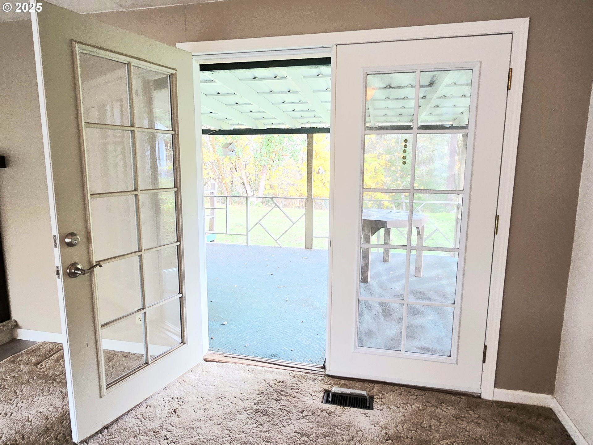 239 Arrow Way Myrtle Creek, OR 97457 - Photo 11 of 25 a view of an empty room with wooden floor and a window