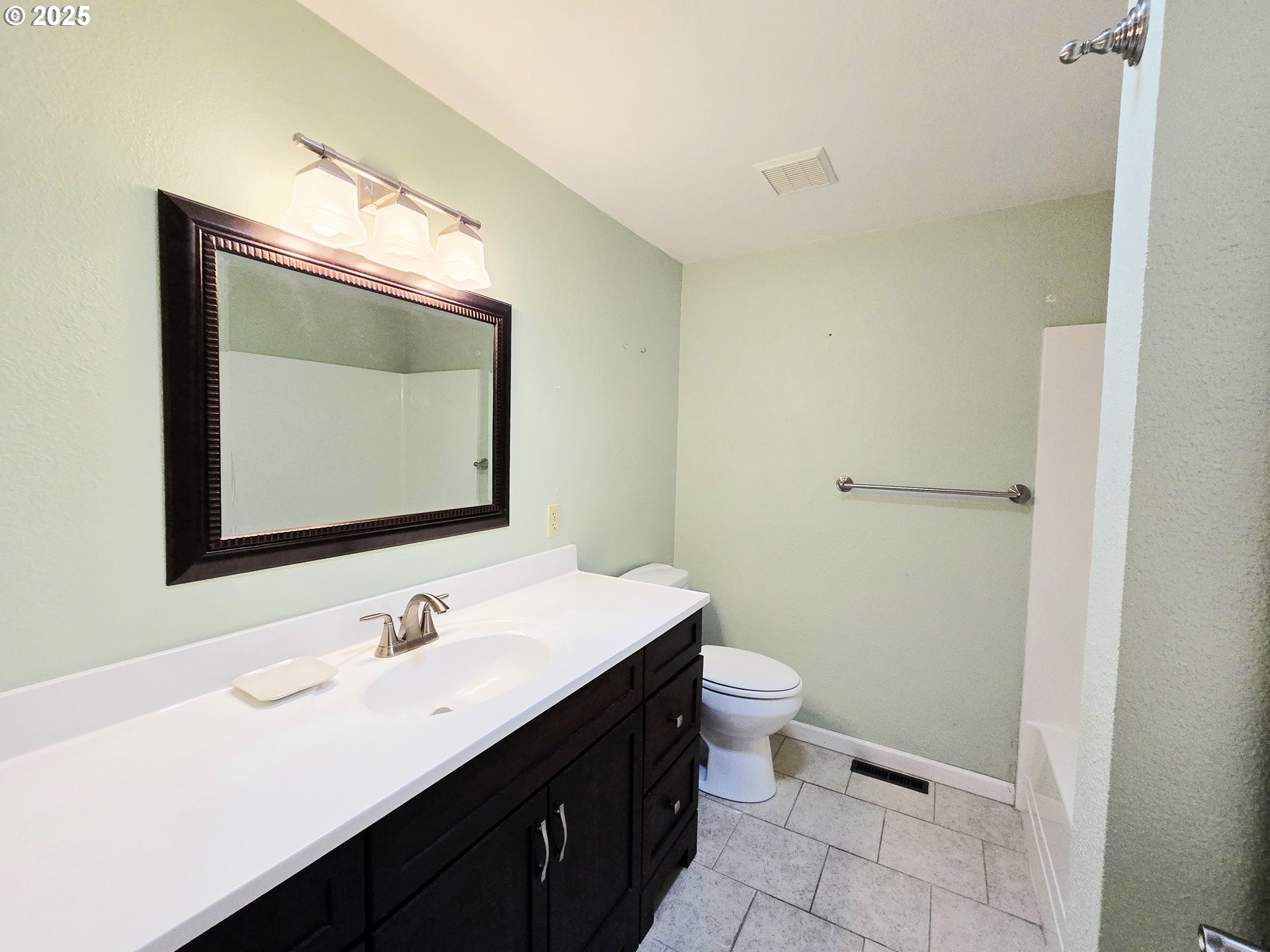 239 Arrow Way Myrtle Creek, OR 97457 - Photo 12 of 25 a bathroom with a toilet a sink a vanity and mirror