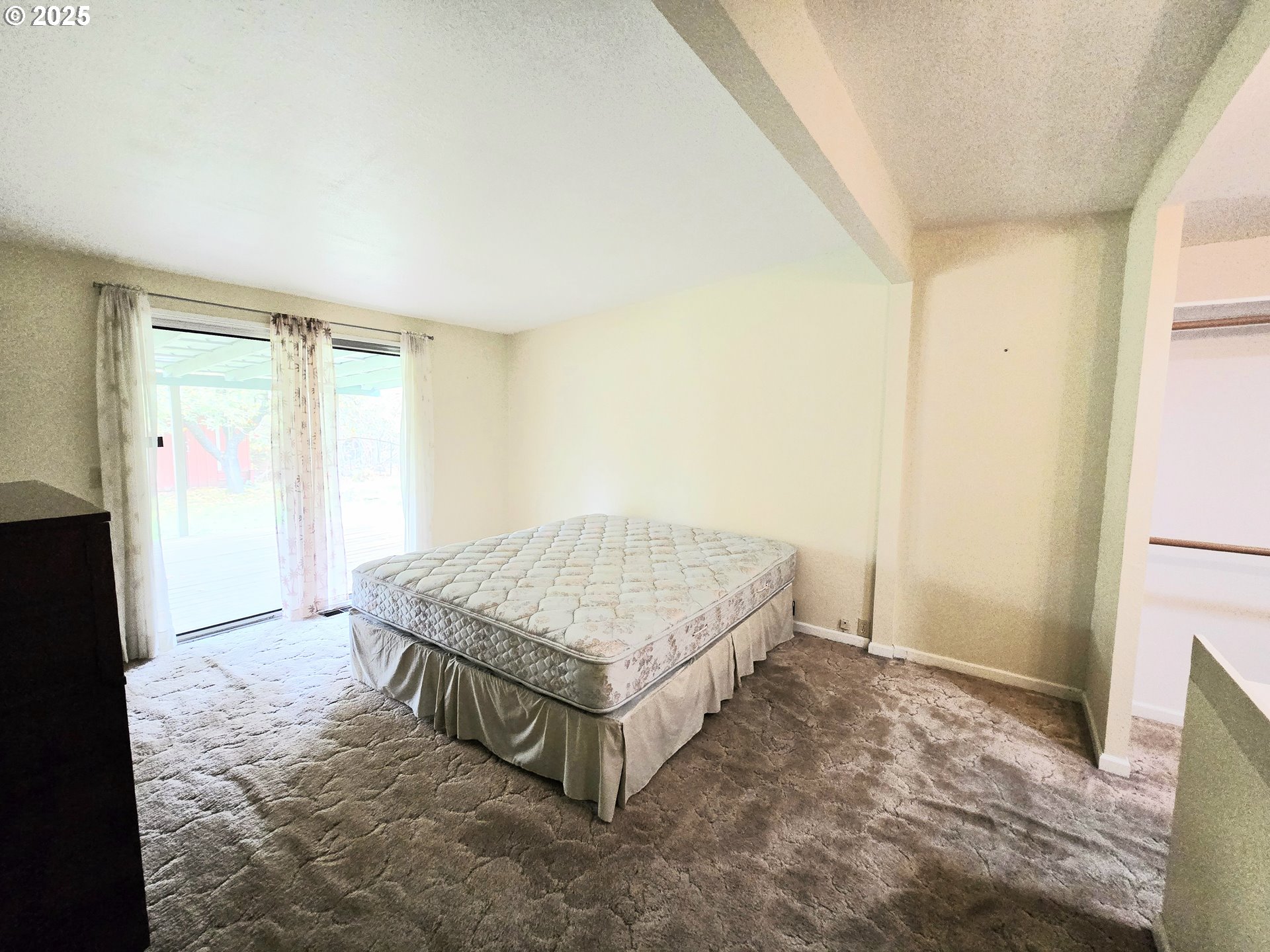 239 Arrow Way Myrtle Creek, OR 97457 - Photo 17 of 25 a living room with a bed and a window