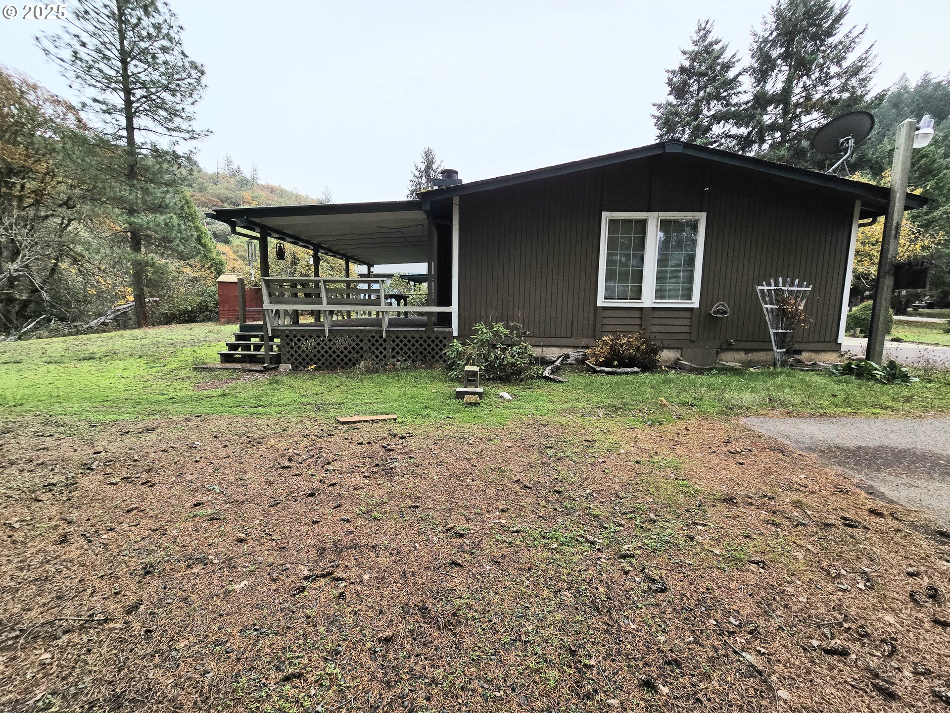 239 Arrow Way Myrtle Creek, OR 97457 - Photo 22 of 25 a backyard of a house with lots of green space