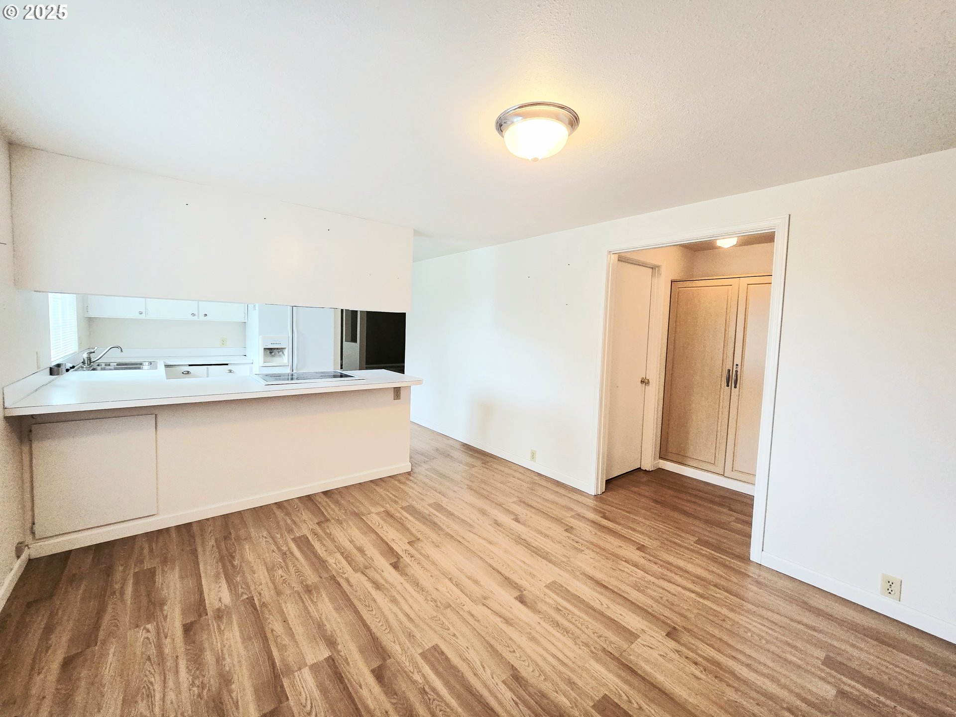 239 Arrow Way Myrtle Creek, OR 97457 - Photo 4 of 25 a view of a kitchen with wooden floor