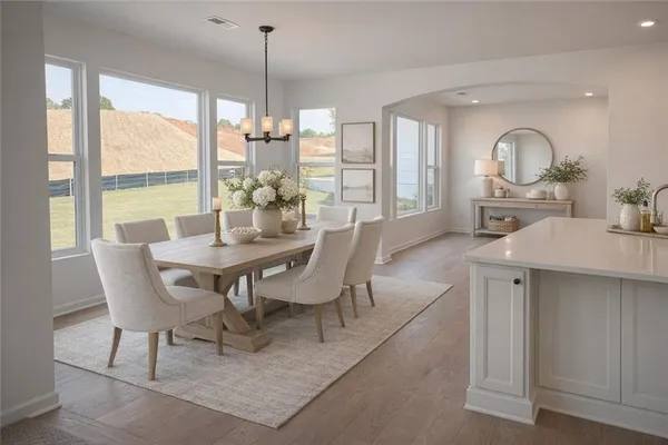 a view of a dining room with furniture window and outside view