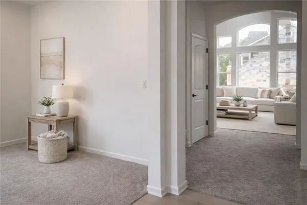 a room with a chair and white walls