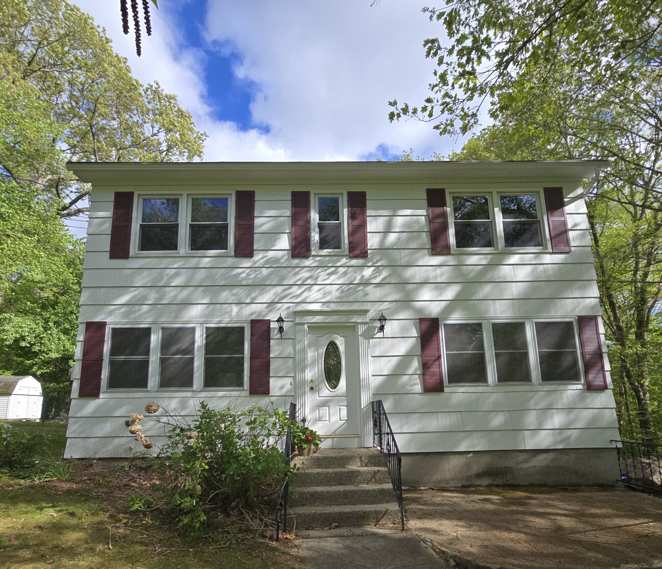 a view of a house with a yard