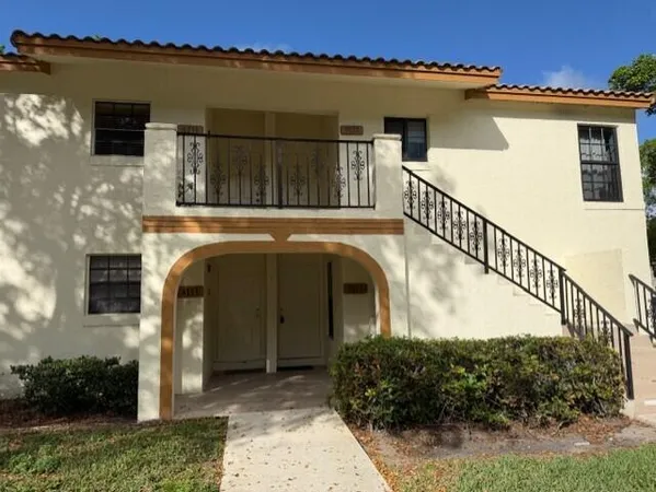 a view of front door and small yard