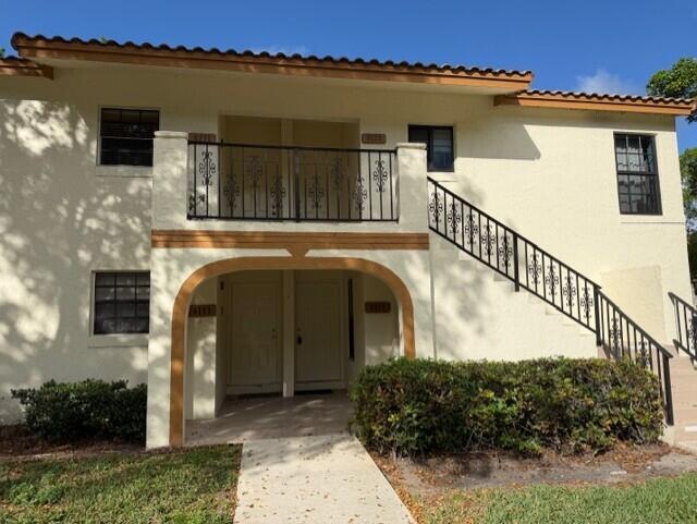 2950 Olivewood Terrace, Unit 1120 Boca Raton, FL 33431 - Photo 11 of 12 a view of front door and small yard
