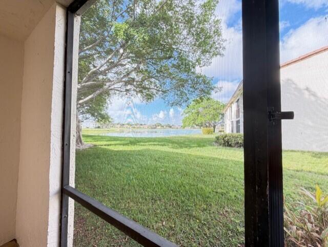 2950 Olivewood Terrace, Unit 1120 Boca Raton, FL 33431 - Photo 12 of 12 a view of a yard from a window
