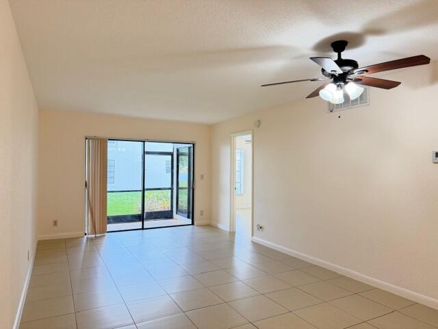 2950 Olivewood Terrace, Unit 1120 Boca Raton, FL 33431 - Photo 2 of 12 a view of an empty room with a window