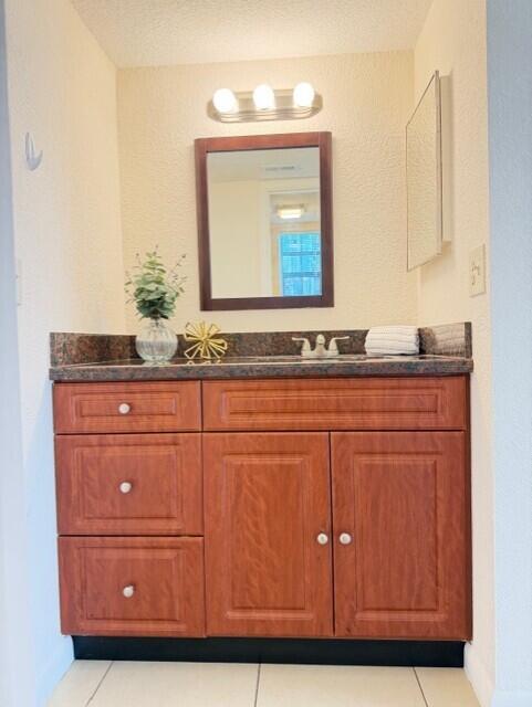2950 Olivewood Terrace, Unit 1120 Boca Raton, FL 33431 - Photo 7 of 12 a bathroom with a sink vanity and mirror