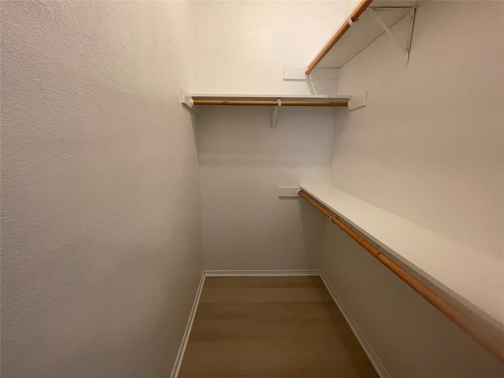 101 Sunburst Court, Unit 107 Weatherford, TX 76087 - Photo 20 of 24 a small space with a bench