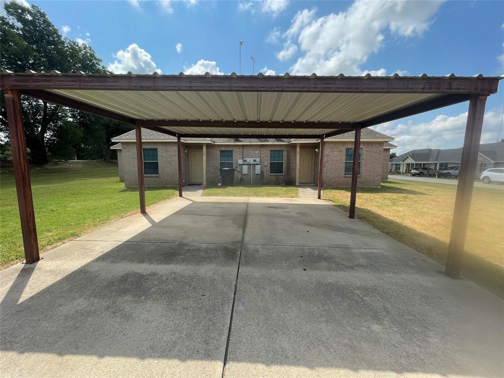 101 Sunburst Court, Unit 107 Weatherford, TX 76087 - Photo 24 of 24 a view of a backyard