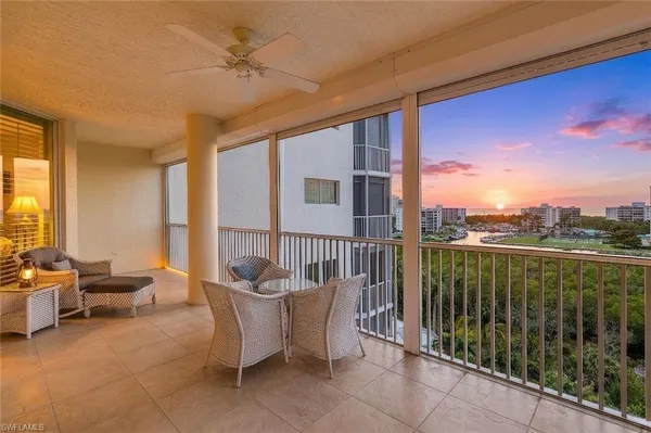 a balcony with furniture and city view