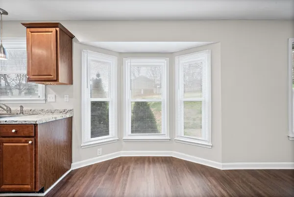 a view of a kitchen with a sink and a window