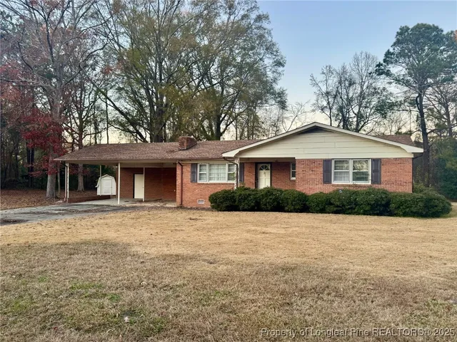 a front view of a house with yard